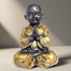 monk buddha polyresin statue for home decor and showpiece gold and black statue showpiece home decor 425162